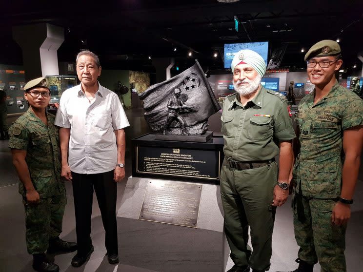 Senior Warrant Officer (Ret.) Ong Hui Pheng (in white shirt) with one of the first national service recruits he trained, Lieutenant Colonel (Ret.) Albel Singh. (PHOTO: Safhras Khan)