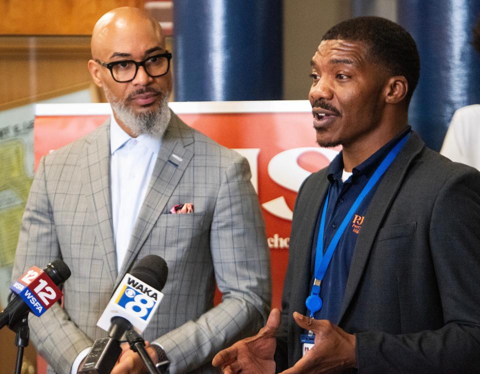 Montgomery Public Schools Superintendent Melvin Brown, left, and Percy Julian High School Principal Ibrahim Lee take part in the announcement of a new conflict resolution program at the school.