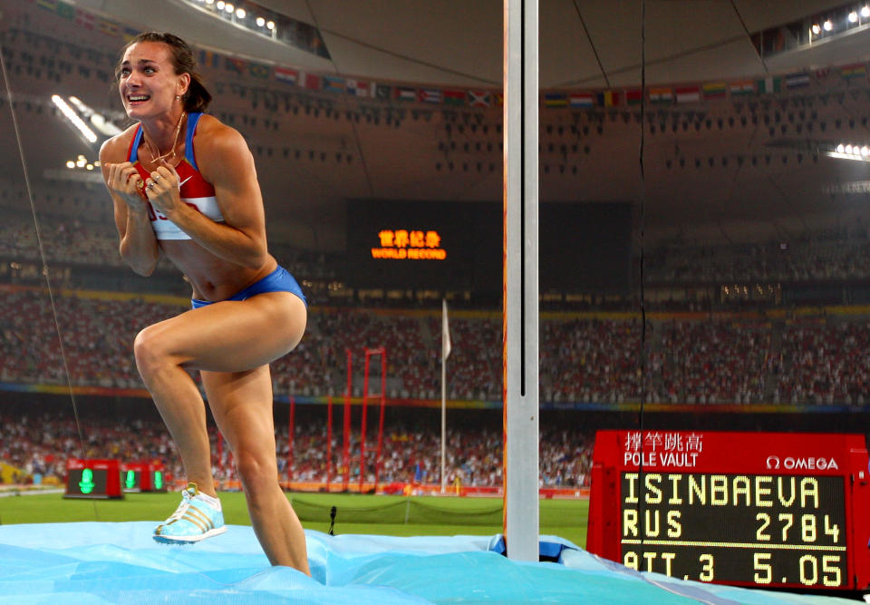 BEIJING - AUGUST 18: Elena Isinbaeva of Russia celebrates successfully jumping a new World Record of 5.05 in the Women's Pole Vault Final at the National Stadium on Day 10 of the Beijing 2008 Olympic Games on August 18, 2008 in Beijing, China. (Photo by Michael Steele/Getty Images)