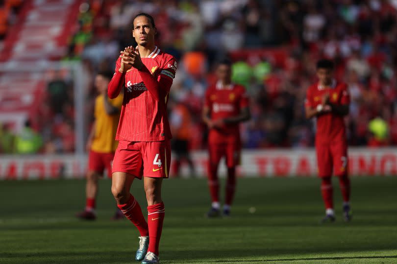 Virgil van Dijk of Liverpool applauds the fans on an end of season lap of honor after the Premier League match between Liverpool FC and Wolverhampton Wanderers at Anfield on May 19, 2024 in Liverpool, England.