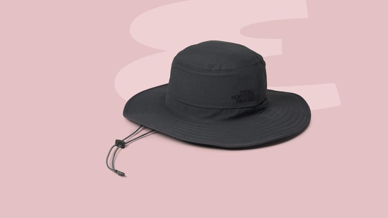 a black hat on a white surface