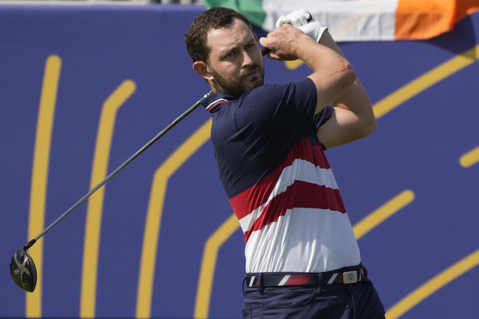 United States' Patrick Cantlay plays his tee shot on the 1st hole during his singles match at the Ryder Cup golf tournament at the Marco Simone Golf Club in Guidonia Montecelio, Italy, Sunday, Oct. 1, 2023. (AP Photo/Alessandra Tarantino)