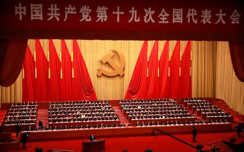 A general view of the hall as Chinese President Xi Jinping delivers his speech - Credit: EPA