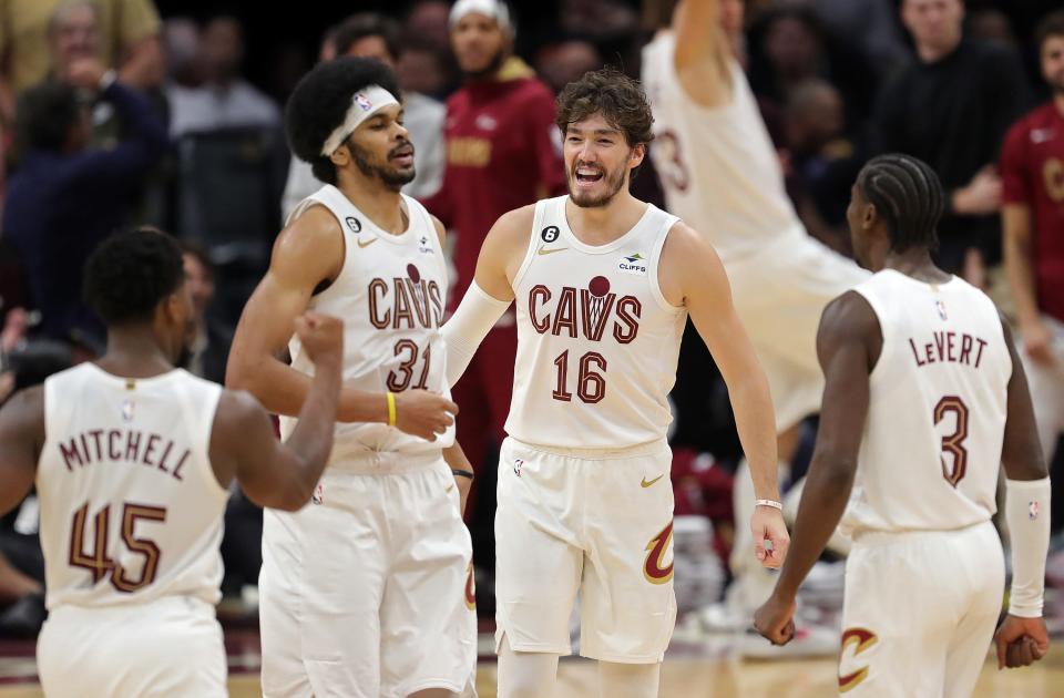 Cleveland Cavaliers forward Cedi Osman (16) celebrates with center Jarrett Allen (31) during an overtime period of an NBA basketball game against the Washington Wizards at Rocket Mortgage FieldHouse, Sunday, Oct. 23, 2022, in Cleveland, Ohio.