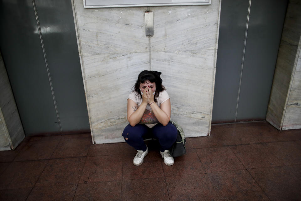 Cecilia Burgos cries outside the courtroom after a judge acquitted former Catholic Priest Carlos Eduardo Jose, citing the statute of limitations had run out on accusations of years of sexual abuse of Mailin Gobbo when she was an adolescent, in San Martin, Argentina, Tuesday, March 9, 2021. Burgos alleges she was sexually abused by the 62-year-old as well. (AP Photo/Natacha Pisarenko)