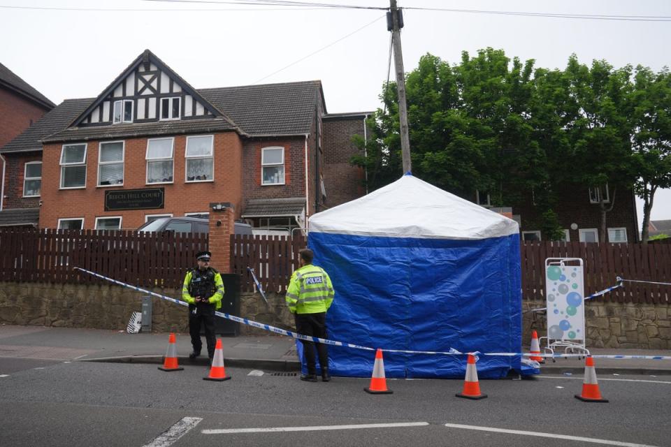 A forensics tent and officers in the street following the attack (Lucy North/PA Wire)