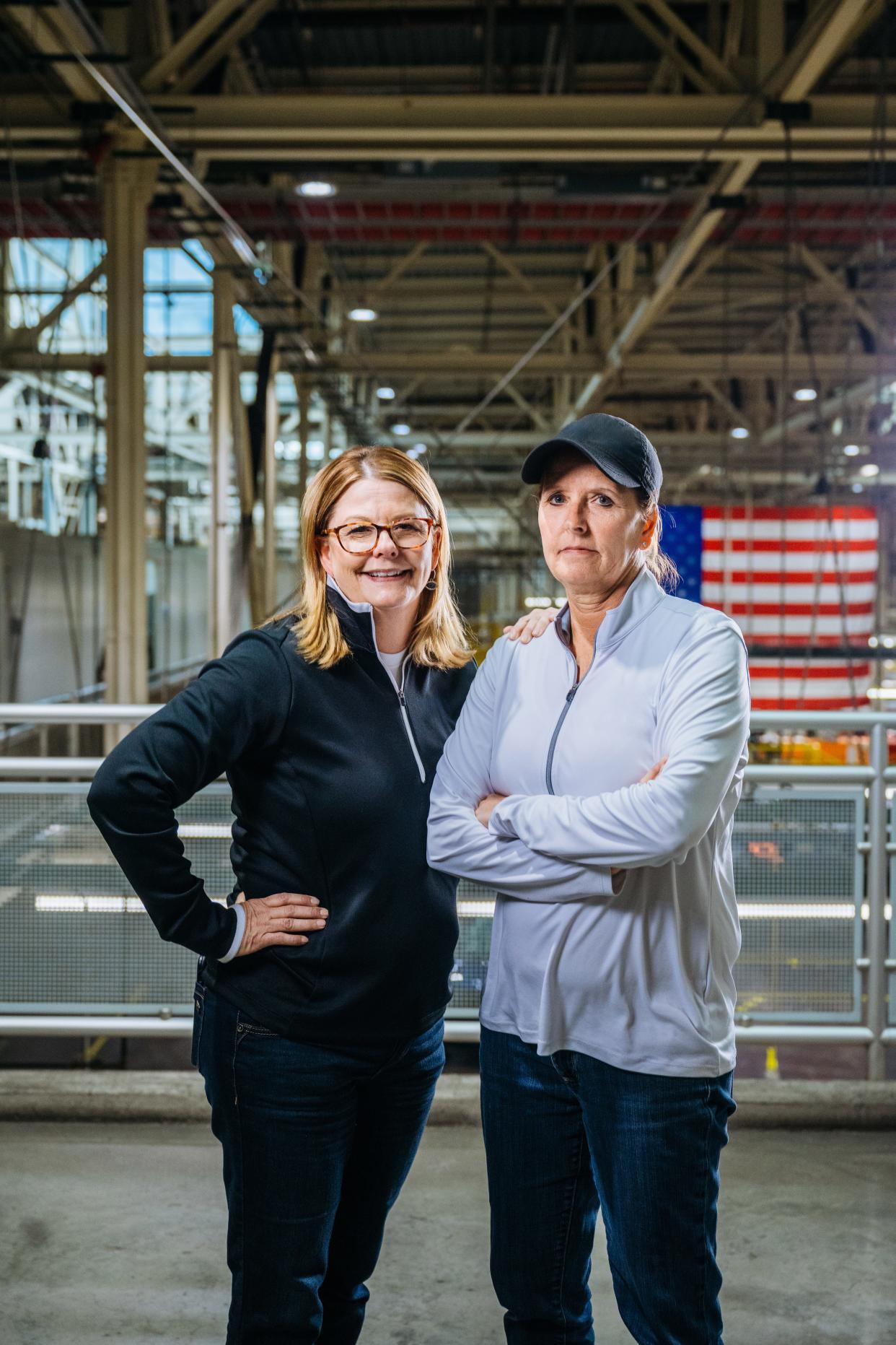 Sisters Wendy Kroll, 50, of Chesterfield (on left) and Penny Cauzillo, 55, of Canton work together to help launch the 2024 Ford F-150. They're seen here at the Dearborn Truck Plant in 2024.