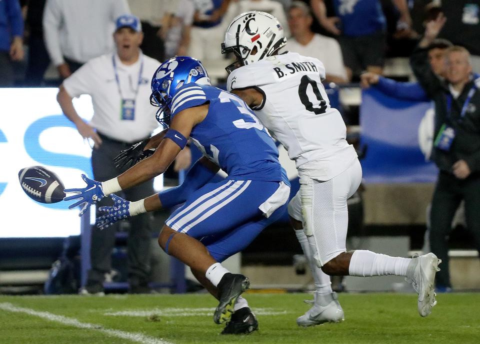 Brigham Young Cougars cornerback Marcus McKenzie (32) tries to recover a muffed punt by Cincinnati Bearcats wide receiver Braden Smith (0) during the second half of a football game at LaVell Edwards Stadium in Provo on Friday, Sept. 29, 2023. BYU won 35-27. | Kristin Murphy, Deseret News