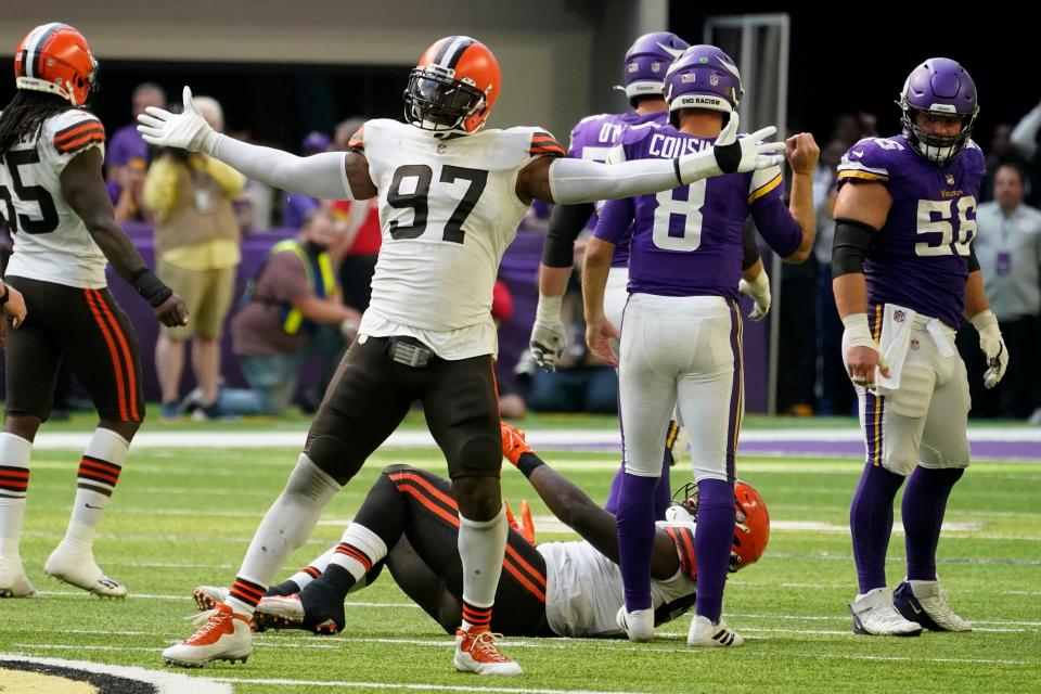 Cleveland Browns defensive tackle Malik Jackson (97) celebrates after making a tackle during the second half of an NFL football game against the Minnesota Vikings, Sunday, Oct. 3, 2021, in Minneapolis. The Browns won 14-7. (AP Photo/Jim Mone)