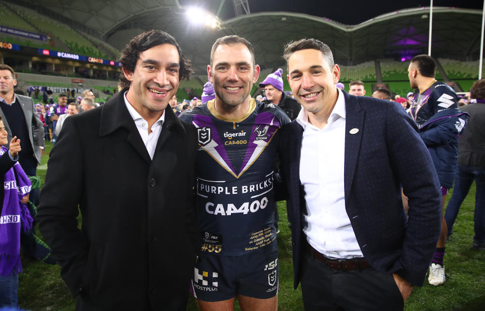 MELBOURNE, AUSTRALIA - JULY 13: Melbourne Storm Captain Cameron Smith poses with Johnathan Thurston and Billy Slater as he leaves the field after becoming the first player to reach 400 matches during the round 17 NRL match between the Melbourne Storm and the Cronulla Sharks at AAMI Park on July 13, 2019 in Melbourne, Australia. (Photo by Scott Barbour/Getty Images)