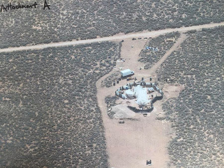 An aerial view of a compound in rural New Mexico where 11 children were taken into protective custody for their own health and safety after a raid by authorities, is shown in this photo near Amalia, New Mexico, U.S., provided August 6, 2018. Taos County Sheriff's Office/Handout via REUTERS