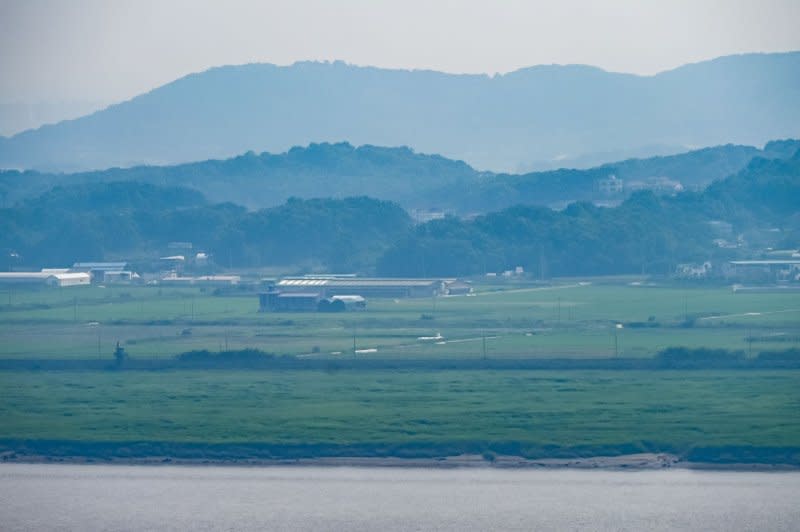 A North Korean village at the edge of the DMZ near the Imjingang and Hangang rivers is seen from Odusan Unification Observatory near Paju, South Korea on June 24. Photo by Thomas Maresca/UPI