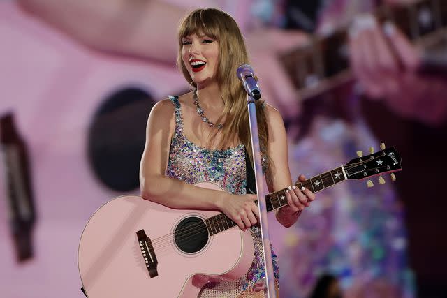 <p>Ashok Kumar/TAS24/Getty</p> Taylor Swift performs during her Eras Tour stop at the National Stadium in Singapore.