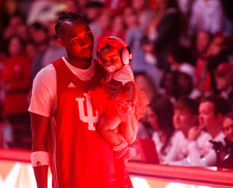 Indiana's Tamar Bates and his child during Hoosier Hysteria for the basketball programs at Simon Skjodt Assembly Hall on Friday, Oct. 7, 2022.