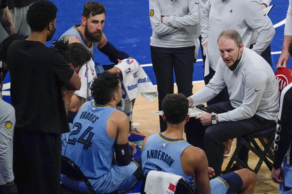 Memphis Grizzlies coach Taylor Jenkins, right, talks to players during a timeout in the second half of an NBA basketball game against the New York Knicks, Friday, April 9, 2021, at Madison Square Garden in New York. (AP Photo/Mary Altaffer, Pool)