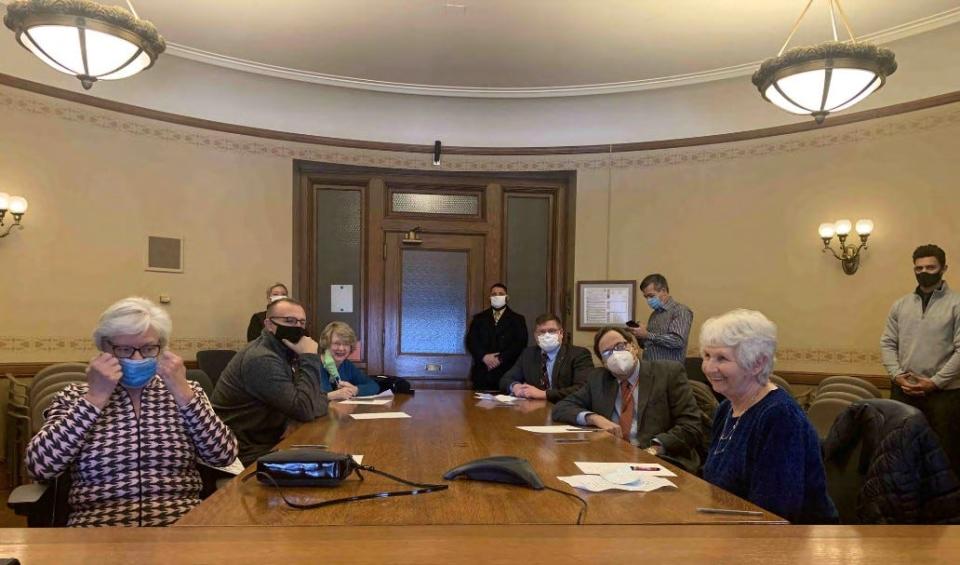 Wisconsin Republicans meet in a state Capitol hearing room on Dec. 14, 2020 to sign paperwork claiming to be electors for Donald Trump despite his election loss.