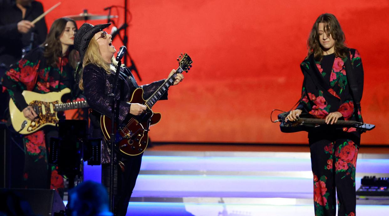 Melissa Etheridge (center) performs with Rebecca and Megan Lovell of Larkin Poe during the 2024 MusiCares Person of the Year gala at the LA Convention Center in Los Angeles, Feb. 2, 2024.