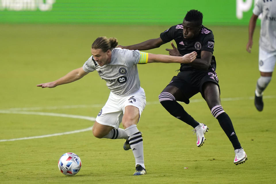 Montreal midfielder Samuel Piette, left, and Inter Miami midfielder Blaise Matuidi, right, go for the ball during the first half of an MLS soccer match Wednesday, May 12, 2021, in Fort Lauderdale, Fla. (AP Photo/Lynne Sladky)
