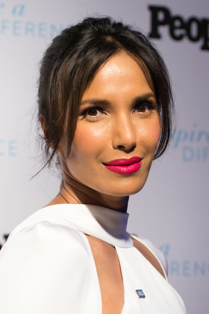 <p>The <em>Top Chef</em> host and cookbook author left us speechless when she stepped out at the 2017 Inspire A Difference Honors event sporting an effortless updo and a bold pink lip. (Photo: Getty Images) </p>