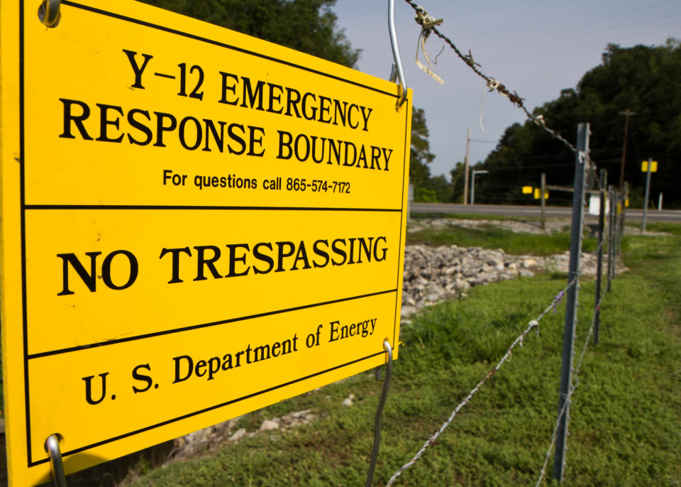 FILE - In this Aug. 17, 2012, file photo, signs warn against trespassing onto the Y-12 National Security Complex in Oak Ridge, Tenn. Three nuclear protesters, including an octogenarian nun, are scheduled to be sentenced on Tuesday, Jan. 28, 2014, for their convictions for breaking into the facility and painting slogans on the outside wall of its uranium processing plant. (AP Photo/Erik Schelzig, file)