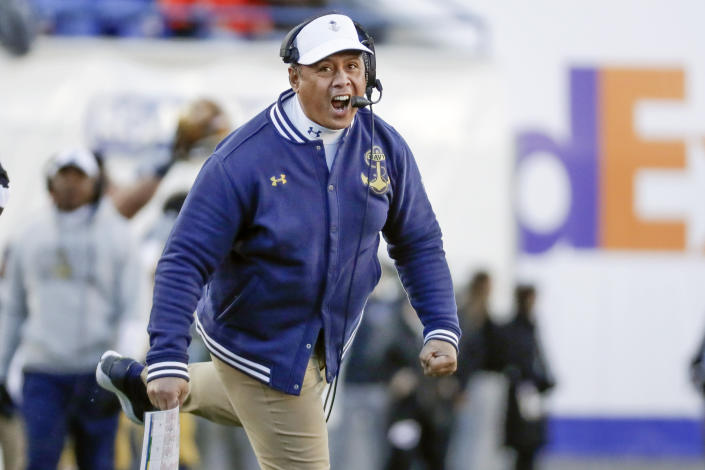 Navy head coach Ken Niumatalolo cheers his team on in the first half of the Liberty Bowl NCAA college football game between Navy and Kansas State Tuesday, Dec. 31, 2019, in Memphis, Tenn. (AP Photo/Mark Humphrey)