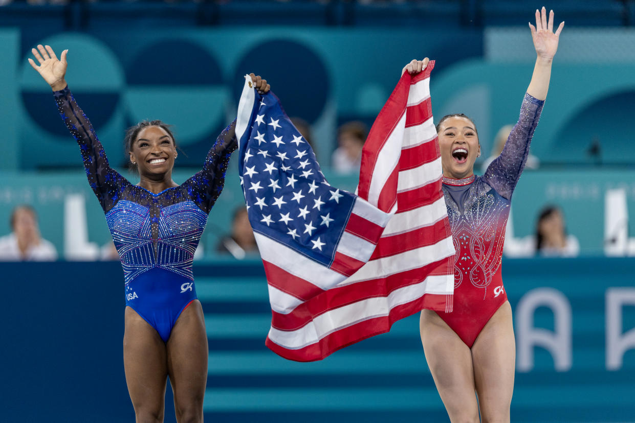 PARIS, FRANCE: AUGUST 01: Gold medal winner Simone Biles of the United States and bronze medal winner Sunisa Lee of the United States celebrate their victory after the Artistic Gymnastics Individual All-Around Final for Women at the Bercy Arena during the Paris 2024 Summer Olympic Games on August 1st, 2024 in Paris, France. (Photo by Tim Clayton/Corbis via Getty Images)