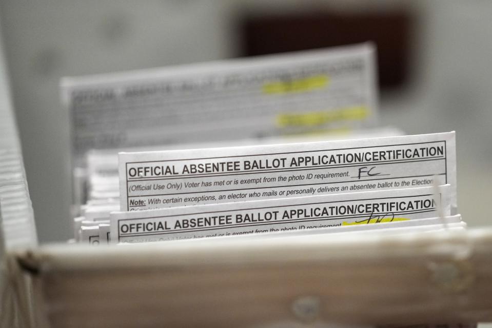 FILE - Absentee ballots are seen during a count at the Wisconsin Center for the midterm election on Nov. 8, 2022, in Milwaukee. (AP Photo/Morry Gash, File)