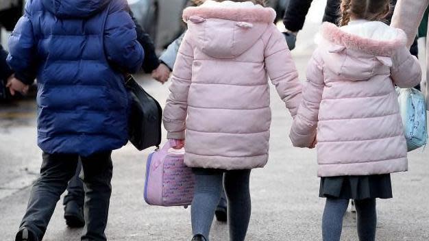 Rear view of three children