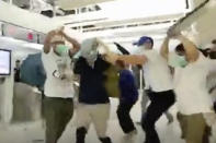 In this image taken from a video footage run by The Stand News via AP Video, white shirted men attack a man dressed in black shirt at a subway station in Hong Kong on Sunday, July 21, 2019. China doesn't want to intervene in Hong Kong's protests but that doesn't mean it won't, as a thuggish attack on the protesters brought accusations of connivance between police and criminal gangs. (The Stand News via AP Video) HONG KONG OUT