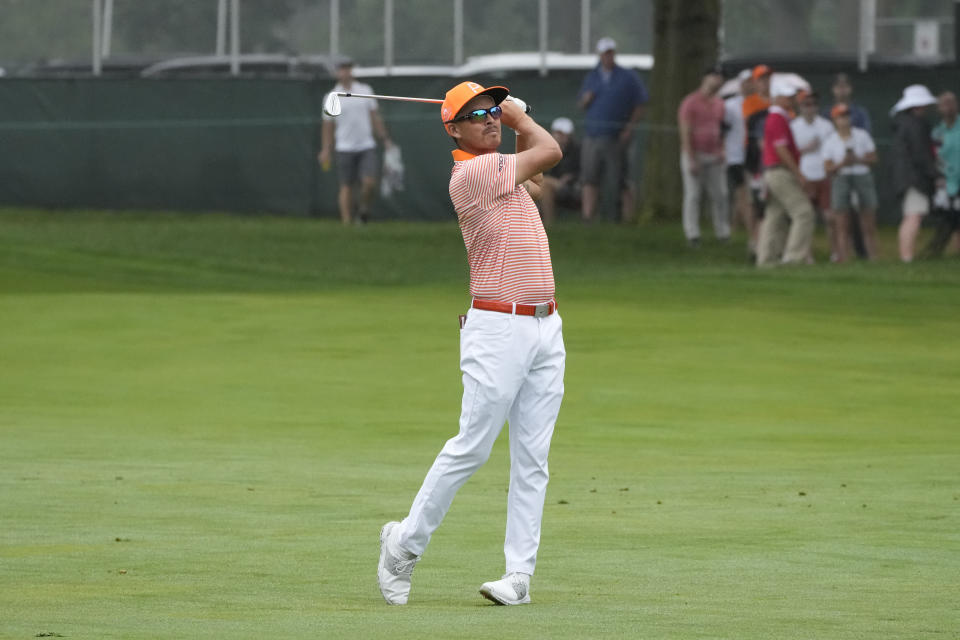 Rickie Fowler hits his approach shot onto the second green during the final round of the Rocket Mortgage Classic golf tournament at Detroit Country Club, Sunday, July 2, 2023, in Detroit. (AP Photo/Carlos Osorio)