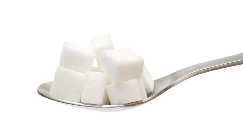 Sugar cubes on spoon