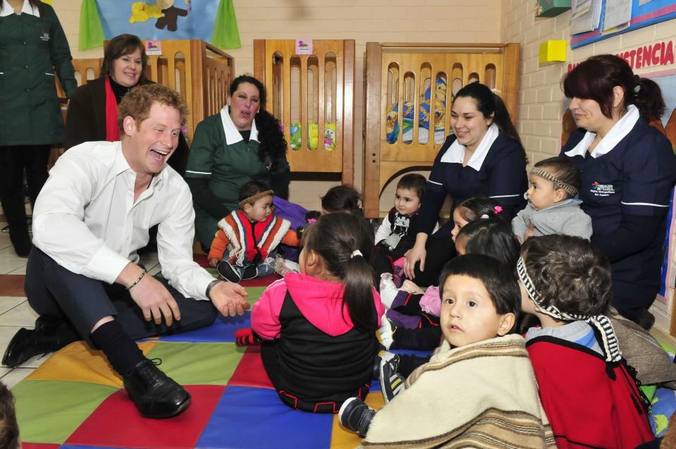 Britain's Prince Harry meets Mapuche children during a visit to Integra Foundation, a daycare center for at-risk children, in Santiago