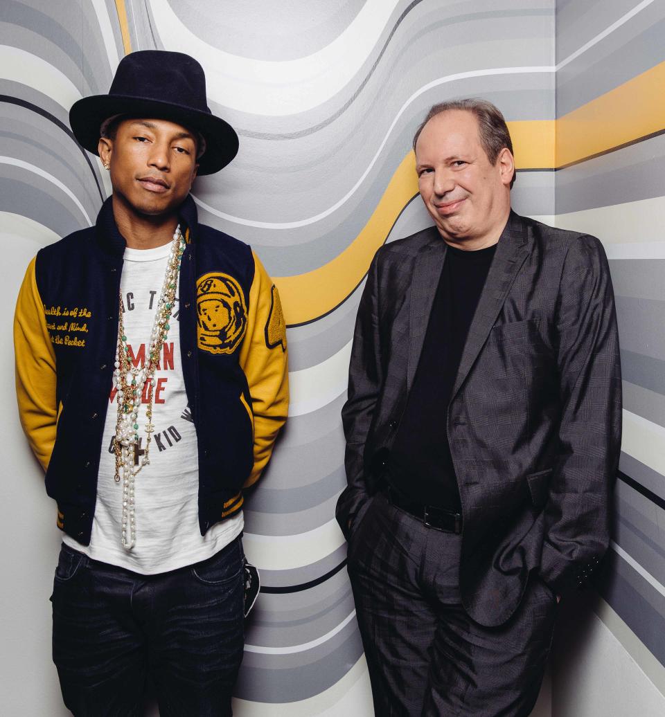 In this Tuesday, March 25, 2014 photo, Pharrell, left, and Hans Zimmer pose at The Standard Hotel during press day for their collaboration on the soundtrack for "The Amazing Spider-Man 2," in Los Angeles. The film releases May 2, 2014. (Photo by Casey Curry/Invision/AP)