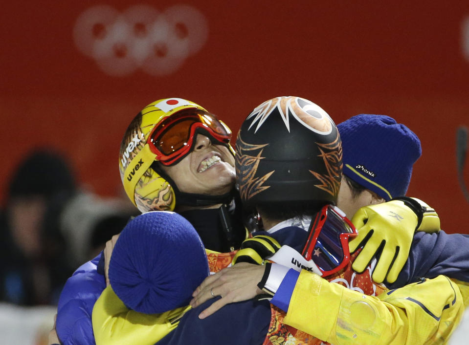 Japan's Noriaki Kasai, left, celebrates winning the silver after the ski jumping large hill final at the 2014 Winter Olympics, Saturday, Feb. 15, 2014, in Krasnaya Polyana, Russia. (AP Photo/Gregorio Borgia)