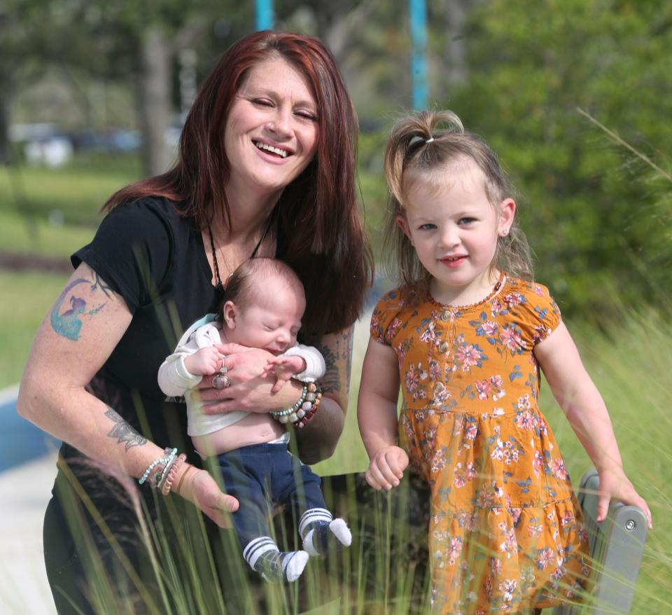 Angela Bennardo used Medicaid during both of her pregnancies, and she found the government-run system confusing and slow to provide the help she needed. Bennardo is pictured having a fun morning at the Riverfront Esplanade in Daytona Beach one day last month with her children, 2-year-old Addi Barry and 6-week-old Hendrix Barry.