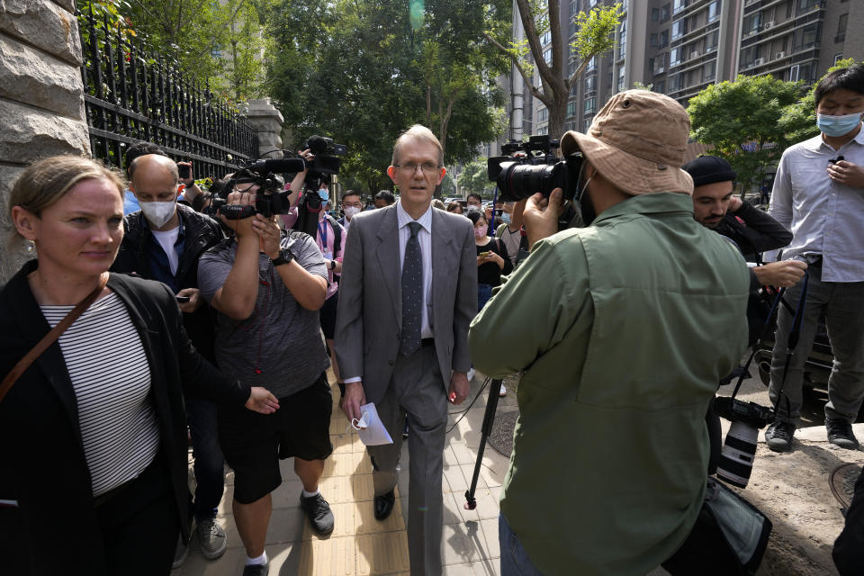 Australian ambassador to China Graham Fletcher, center, is surrounded by reporters outside the No. 2 Intermediate People's Court after he was denied to attend the espionage charges case for Yang Hengjun, in Beijing, Thursday, May 27, 2021. Fletcher said it was “regrettable” that the embassy was denied access Thursday as a trial was due to start for Yang, a Chinese Australian man charged with espionage. (AP Photo/Andy Wong)