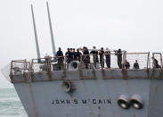 <p>Personnel work on the U.S. Navy guided-missile destroyer USS John S. McCain after a collision, in Singapore waters Aug. 21, 2017. (Photo: Ahmad Masood/Reuters) </p>