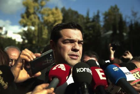 Alexis Tsipras, opposition leader and head of radical leftist Syriza party, talks to reporters outside the parliament building after the last round of a presidential vote in Athens December 29, 2014. REUTERS/Alkis konstantinidis