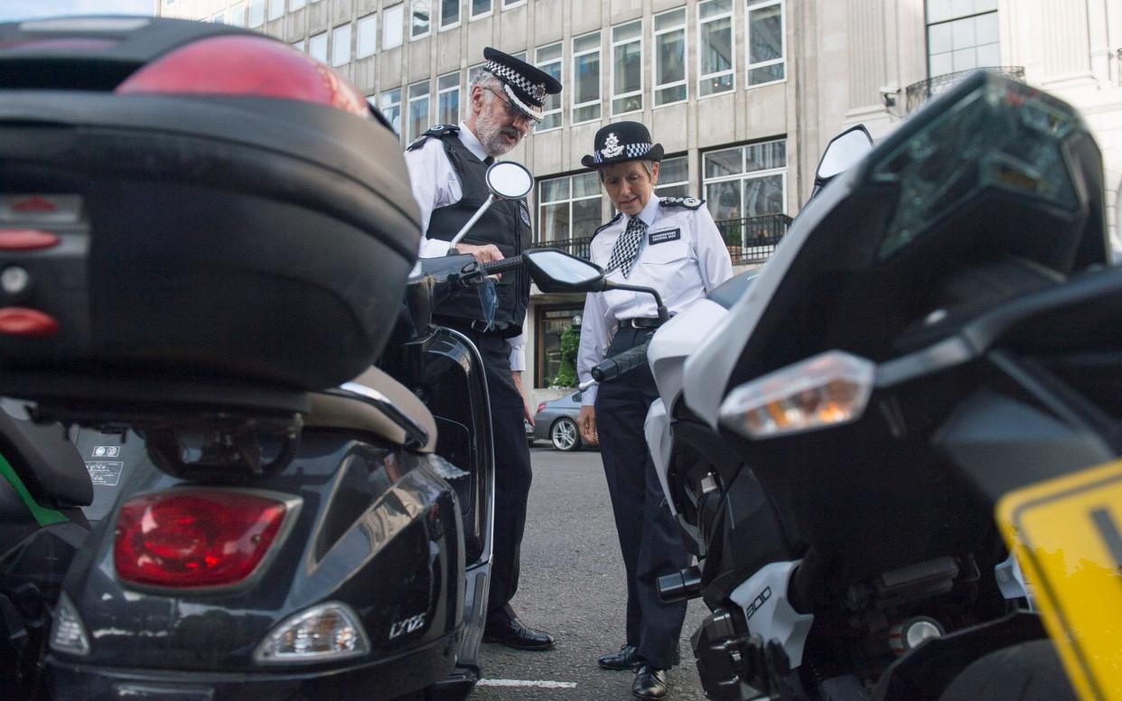 Metropolitan Police Commissioner Cressida Dick (right) met motorcycle and scooter riders in Westminster this June, as part of the force's Be Safe campaign to reduce thefts of powered two-wheelers - PA