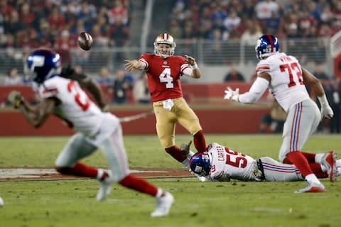 San Francisco 49ers quarterback Nick Mullens (4) throws a pass before being tackled by New York Giants linebacker Lorenzo Carter (59) in the second quarter at Levi's Stadium - Credit: Cary Edmondson/USA Today