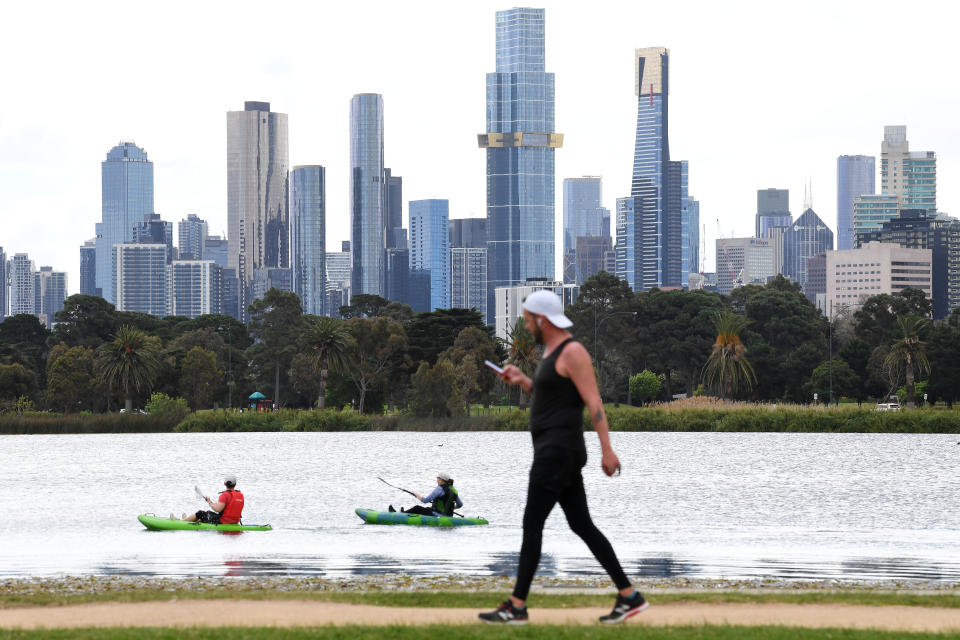 People are seen canoeing at Albert Park Lake in Melbourne, Thursday, October 7, 2021. Source: AAP