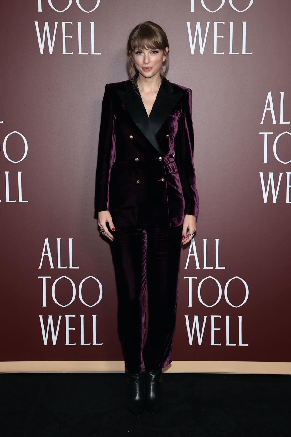 Taylor Swift wears a purple suit at the "All Too Well" short film premiere.