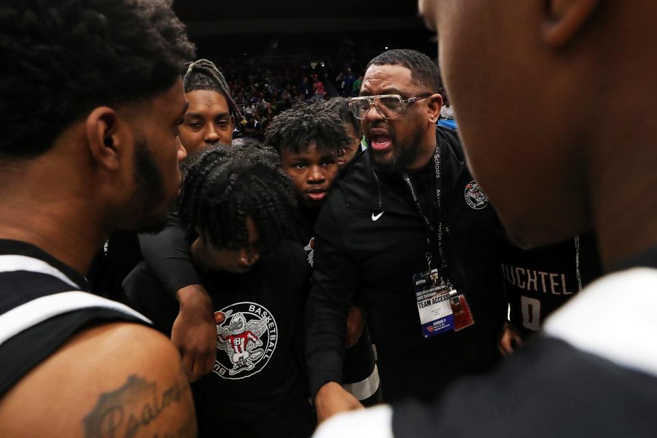 Buchtel basketball coach Rayshon Dent gets his team fired up before the start of a Division II state semifinal basketball game at UD Arena, Friday, March 17, 2023, in Dayton, Ohio.