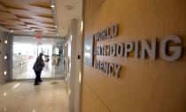 A woman walks into the head office of the World Anti-Doping Agency (WADA) in Montreal, Quebec, Canada November 9, 2015. REUTERS/Christinne Muschi/File Photo - RTSO0J6