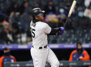 Colorado Rockies' C.J. Cron watches is two-run double off Houston Astros relief pitcher Bryan Abreu during the sixth inning of a baseball game Tuesday, April 20, 2021, in Denver. (AP Photo/David Zalubowski)