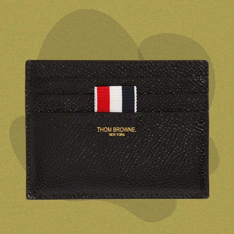 <p>Courtesy of Nordstrom</p><p>Slim designer wallets can sport some truly outrageous price tags, but this card case from Thom Browne is both unmistakably handsome and relatively reasonably priced. It’s made in Italy from pebbled black leather. One side has three simple card slots while the other has another three simple card slots, a gold logo, and the designer’s trademark: a red-, white-, and blue-striped grosgrain tab — a heavy, ribbed piece of fabric that’s satisfying to look at and touch in a way that the best designer goods often are.</p><p>[$280; <a href="https://click.linksynergy.com/deeplink?id=b8woVWHCa*0&mid=1237&u1=mj-bestslimwallets-cleblanc-081023-update&murl=https%3A%2F%2Fwww.nordstrom.com%2Fs%2Fthom-browne-card-case%2F5299304" rel="nofollow noopener" target="_blank" data-ylk="slk:nordstrom.com;elm:context_link;itc:0;sec:content-canvas" class="link ">nordstrom.com</a>]</p>