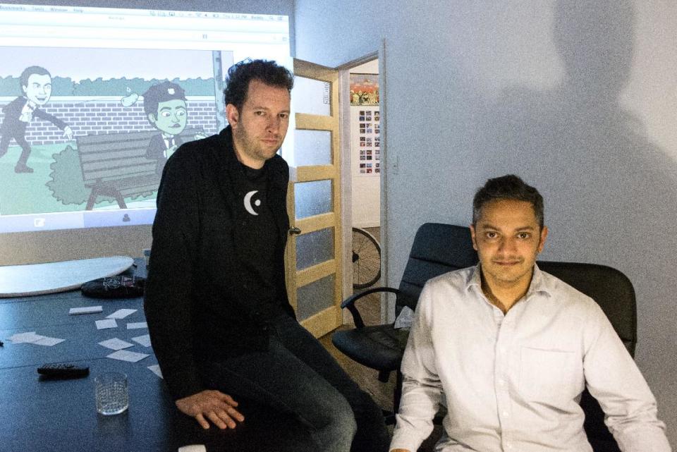 In this Dec. 19, 2013 photo, Bitstrips CEO and Creative Director Jacob Blackstock, left, and co-founder Shahan Panth pose for a photo at the company's offices in Toronto. Bitstrips, a mobile application that helps people turn their lives into comic strips, may seem like a sudden sensation now that its vignettes are all over Facebook and other social networks. But the Toronto startup’s success has been a drawn-out process. (AP Photo/The Canadian Press, Chris Young)