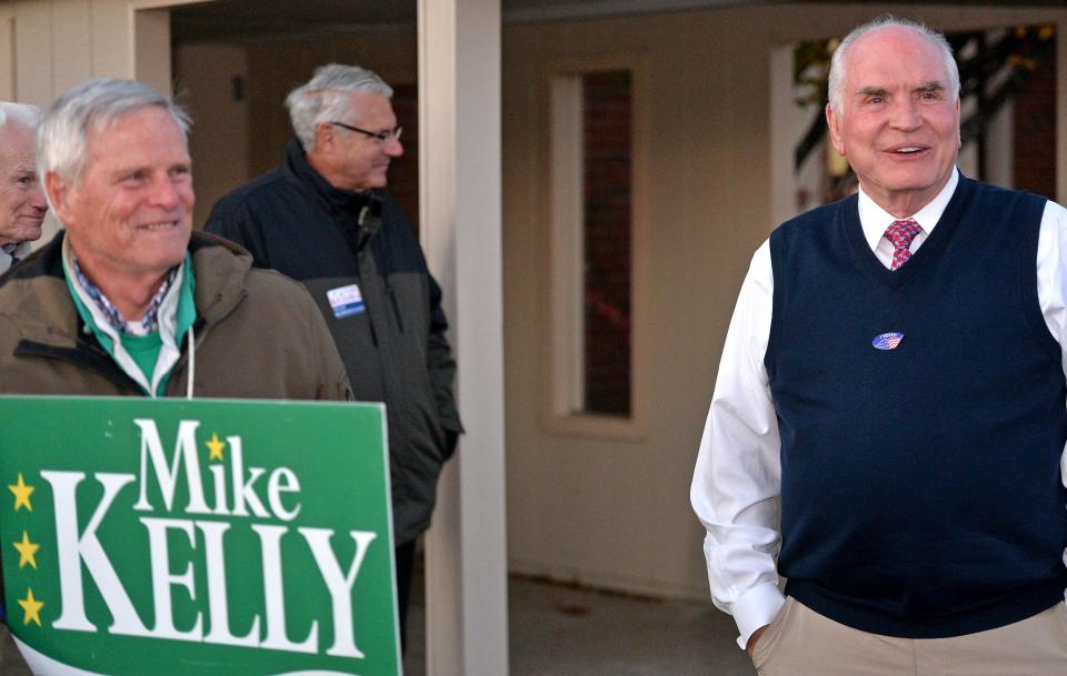 U.S. Rep. Mike Kelly, of Butler, R-16th Dist., at right, greets midterm election voters outside the Millcreek 24th District polling place at Church of the Cross in Millcreek Township, Erie County, on Tuesday. At left is Erie County Republican Committee Chairman Tom Eddy.