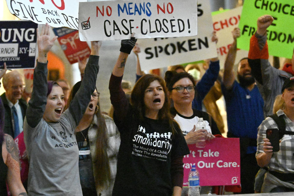 Protester outside the Kentucky Supreme Court chambers rally in favor of abortion rights as the Kentucky Supreme Court hears arguments whether to temporarily pause the state's abortion ban in Frankfort, Ky., Tuesday, Nov. 15, 2022. (AP Photo/Timothy D. Easley)