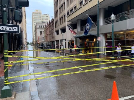 Cordon tape is seen near a flooded street in New Orleans